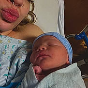 Isaiah is registered to the contest to win money with this photo: newborn, baby, mother, hospital, blanket, hat, piercing, nose_ring, sleeping, face, skin, person, bed, hospital_gown, love, family, closeup, new_life, rest, warmth