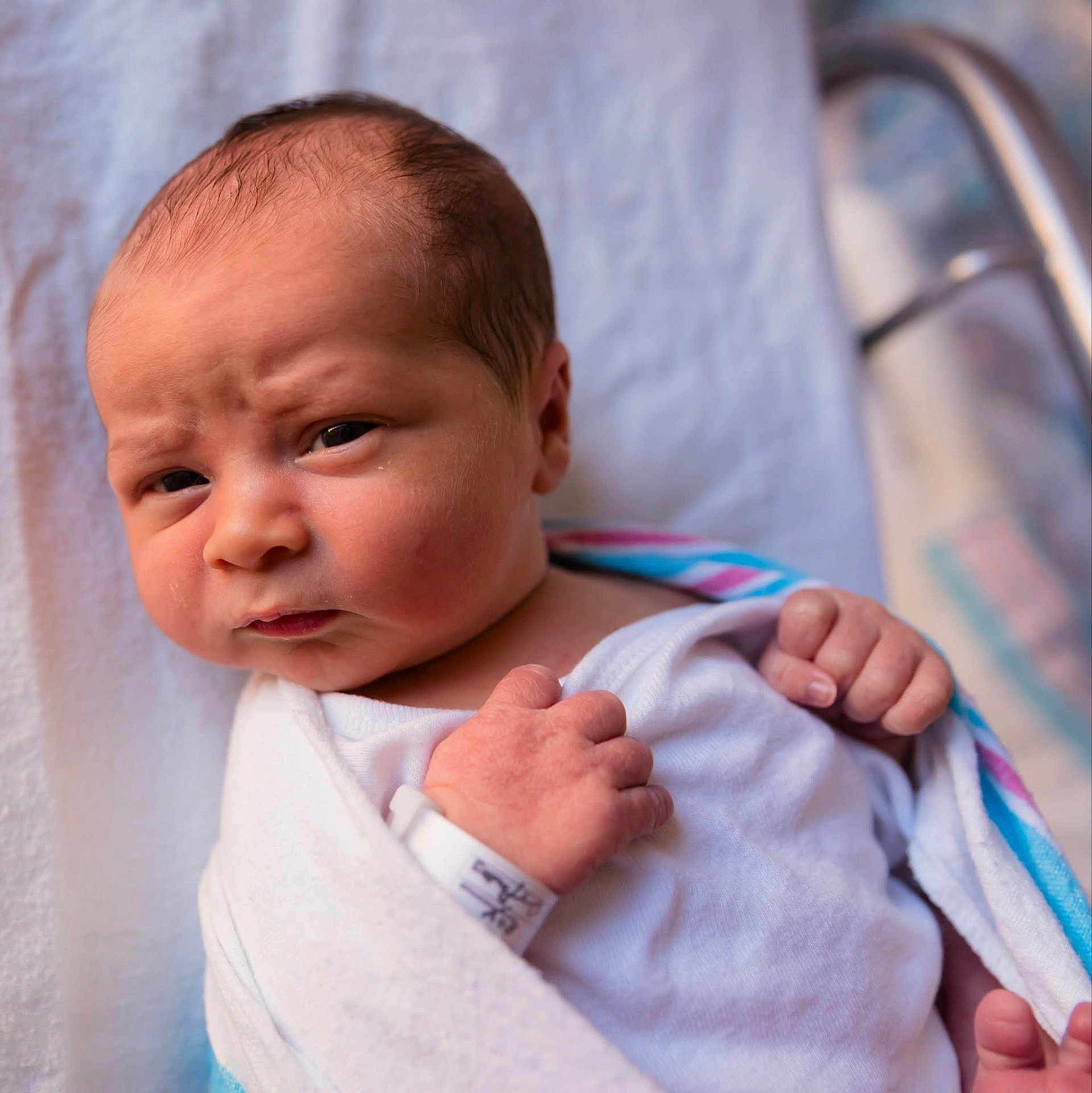 Braxton joined the competition — help win amazing prizes! newborn, baby, infant, wrapped, blanket, hospital, wristband, face, portrait, skin, hand, expression, cute, person, newborn_baby, indoors, closeup, head, lying_down, sleepwear