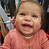Felicity joined the competition — help win amazing prizes! toddler, child, smiling, shopping_cart, pink_cardigan, floral_dress, clothing, retail_store, happy, cute, baby, person, indoor, portrait, face, hair_clip, shopping, retail, joyful, casual