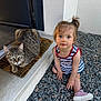Melody a rejoint le concours — aidez-le/la à gagner de superbes lots ! animal, casual, cat, child, clothing, curious, cute, daylight, door, doormat, footwear, gravel, hairstyle, outdoor, person, pet, portrait, sitting, tabby_cat, toddler