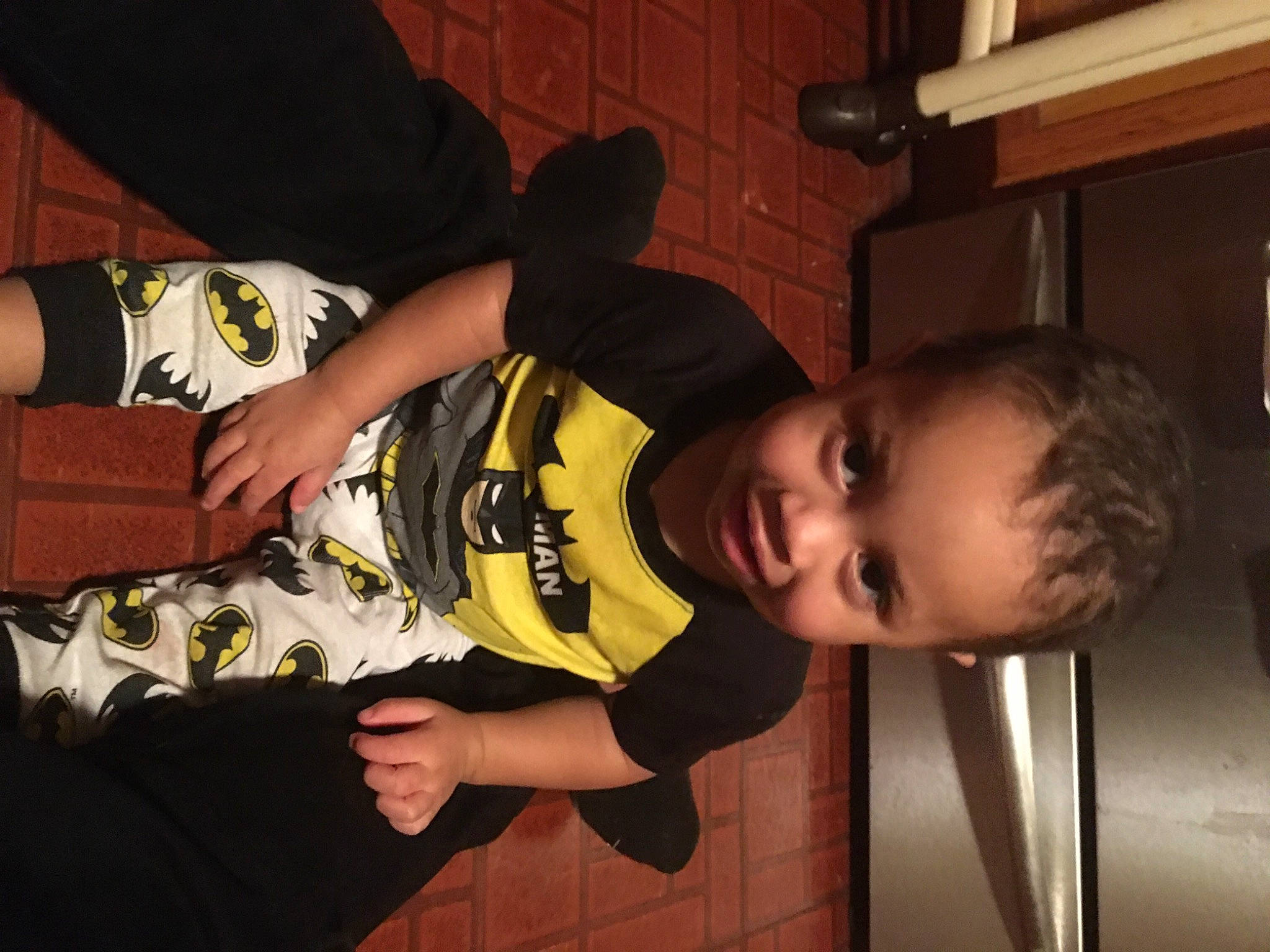 Bellamy is registered to the contest to win money with this photo: baby, baby_toddler_clothing, black_hair, child, elbow, finger, flash_photography, flooring, fun, happy, human_leg, joy, knee, nose, person, room, sitting, sleeve, t_shirt, thigh