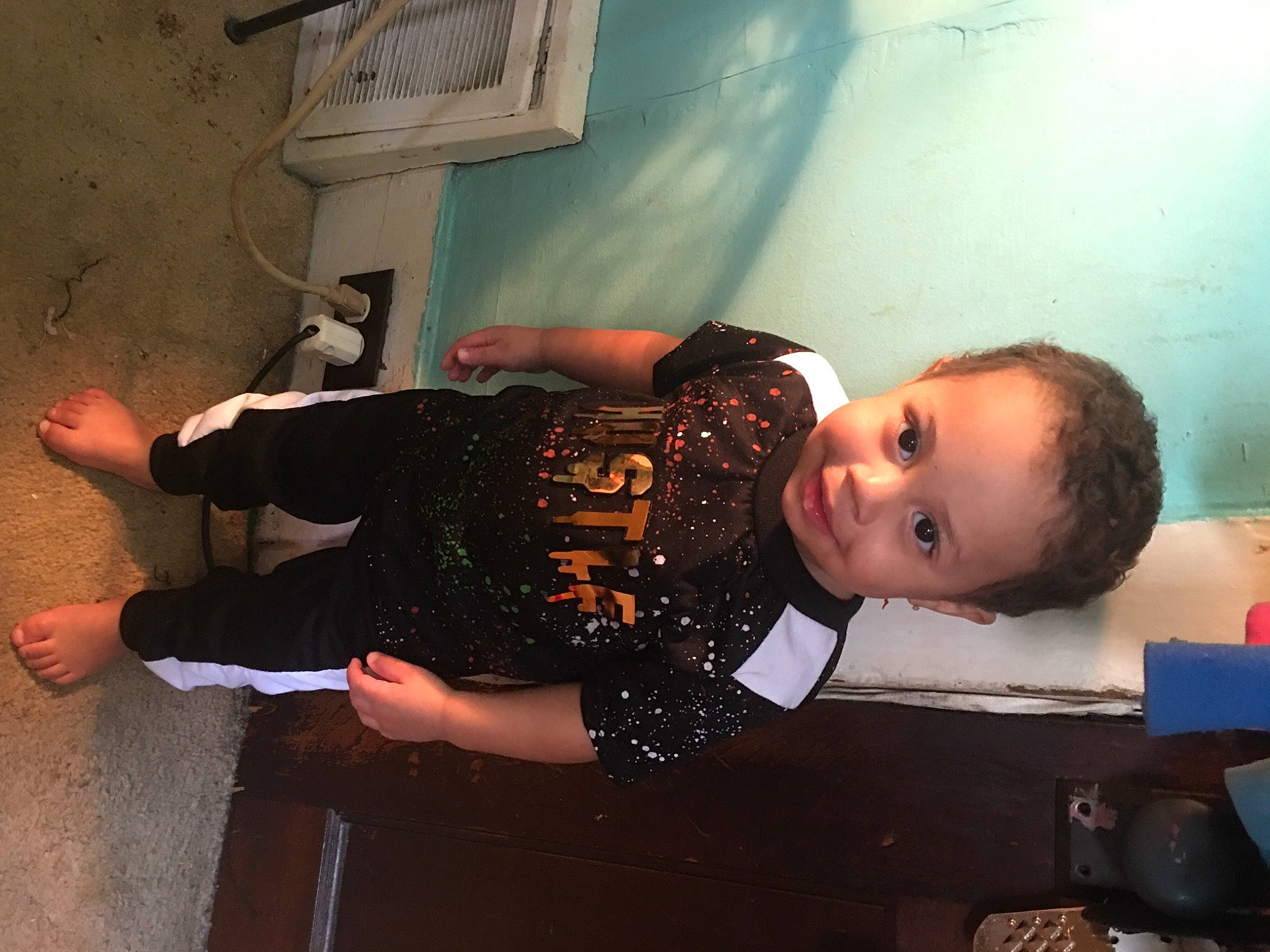 Bellamy is registered to the contest to win money with this photo: arm, child, elbow, flash_photography, flooring, fun, happy, human_leg, joint, knee, person, plaster, room, smile, thigh, toddler, waist, wrist