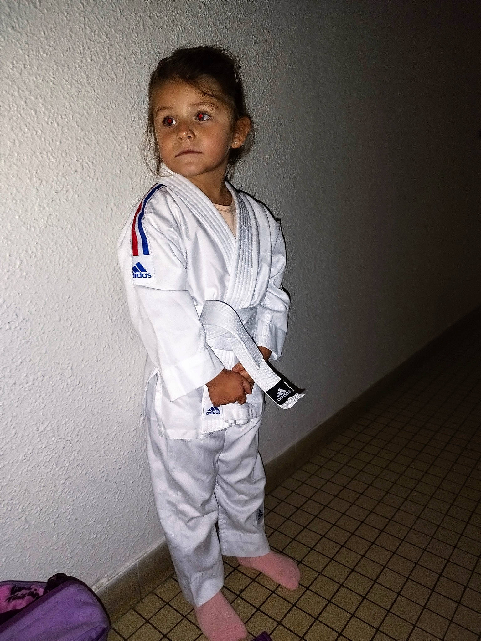 Ilana participe au concours pour gagner de l'argent avec cette photo : baby, child, contact_sport, fashion_design, flooring, formal_wear, gesture, japanese_martial_arts, luggage_and_bags, martial_arts, martial_arts_uniform, outerwear, person, room, school_uniform, sleeve, sports_uniform, sportswear, suit, toddler