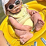 Gabriella a rejoint le concours — aidez-le/la à gagner de superbes lots ! baby, sunglasses, hat, inflatable, float, yellow, water, sunny, beach, summer, child, cute, relaxing, outdoor, sunhat, foot, arm, tattoo, person, vacation