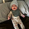 Maverick joined the competition — help win amazing prizes! baby, infant, child, portrait, bed, bedding, pillow, indoors, beanie, hat, bib, pajamas, socks, clothing, sitting, lying_down, open_mouth, looking_at_camera, cozy, home