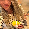 Mazzy Star is registered to the contest to win money with this photo: animal_care, baby_animal, blonde_hair, bottle, close_up, cute, face, feeding, feline, hand, holding, indoor, kitten, nose_ring, pet, smile, striped_shirt, woman, yellow_bottle, young