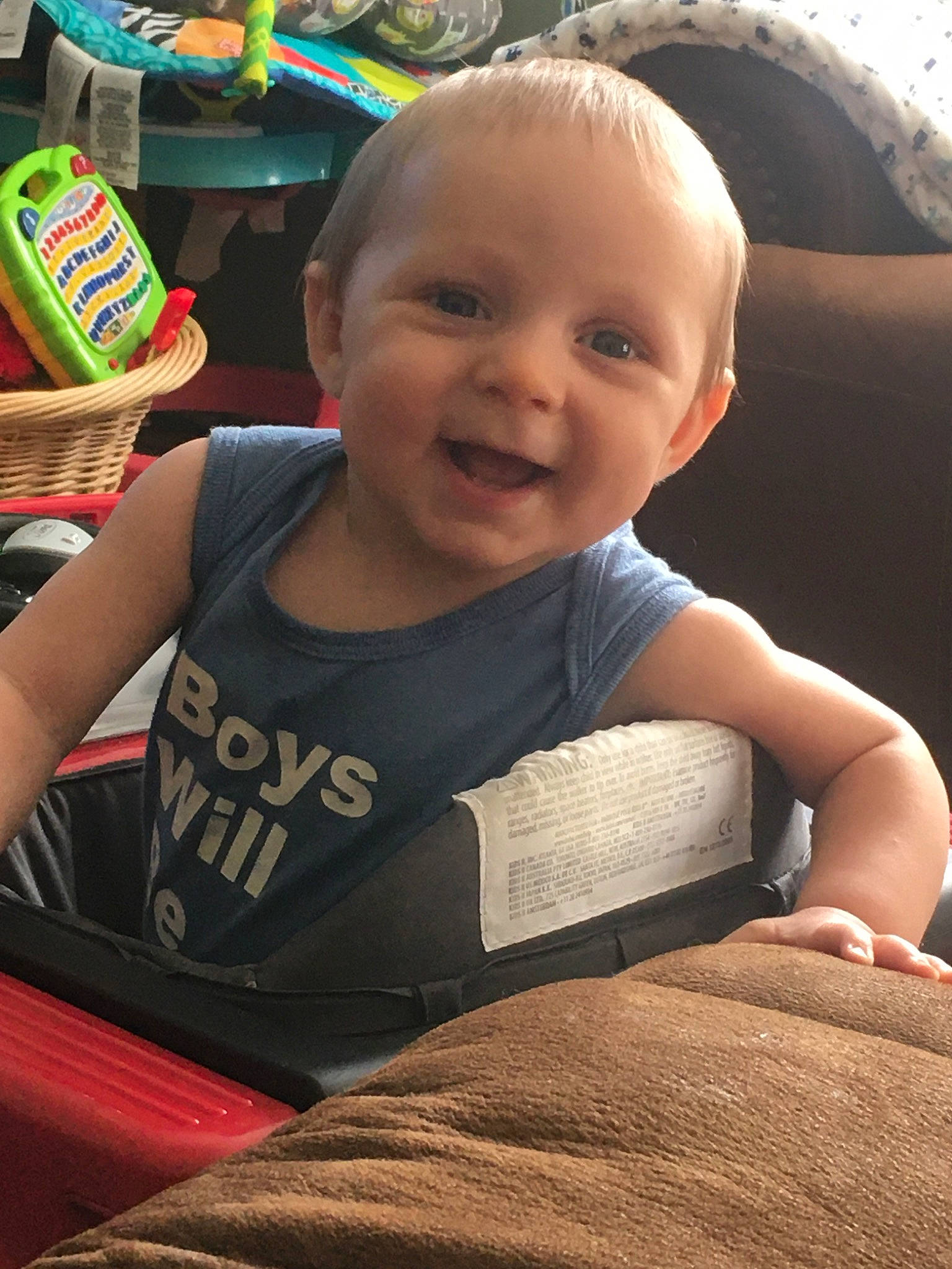 Luther is registered to the contest to win money with this photo: baby, child, eye, face, facial_expression, fun, head, person, play, sitting, skin, smile, toddler, vacation