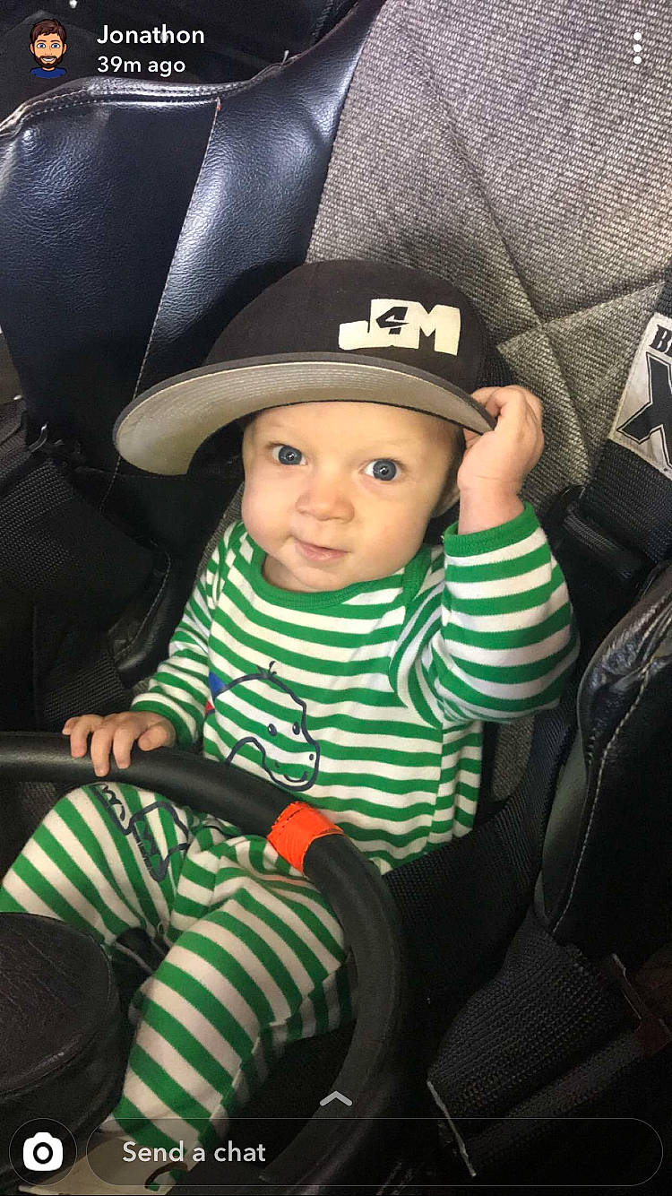 Luther joined the competition — help win amazing prizes! baby, car_seat, child, cool, hat, headgear, headwear, person, product, sitting, toddler