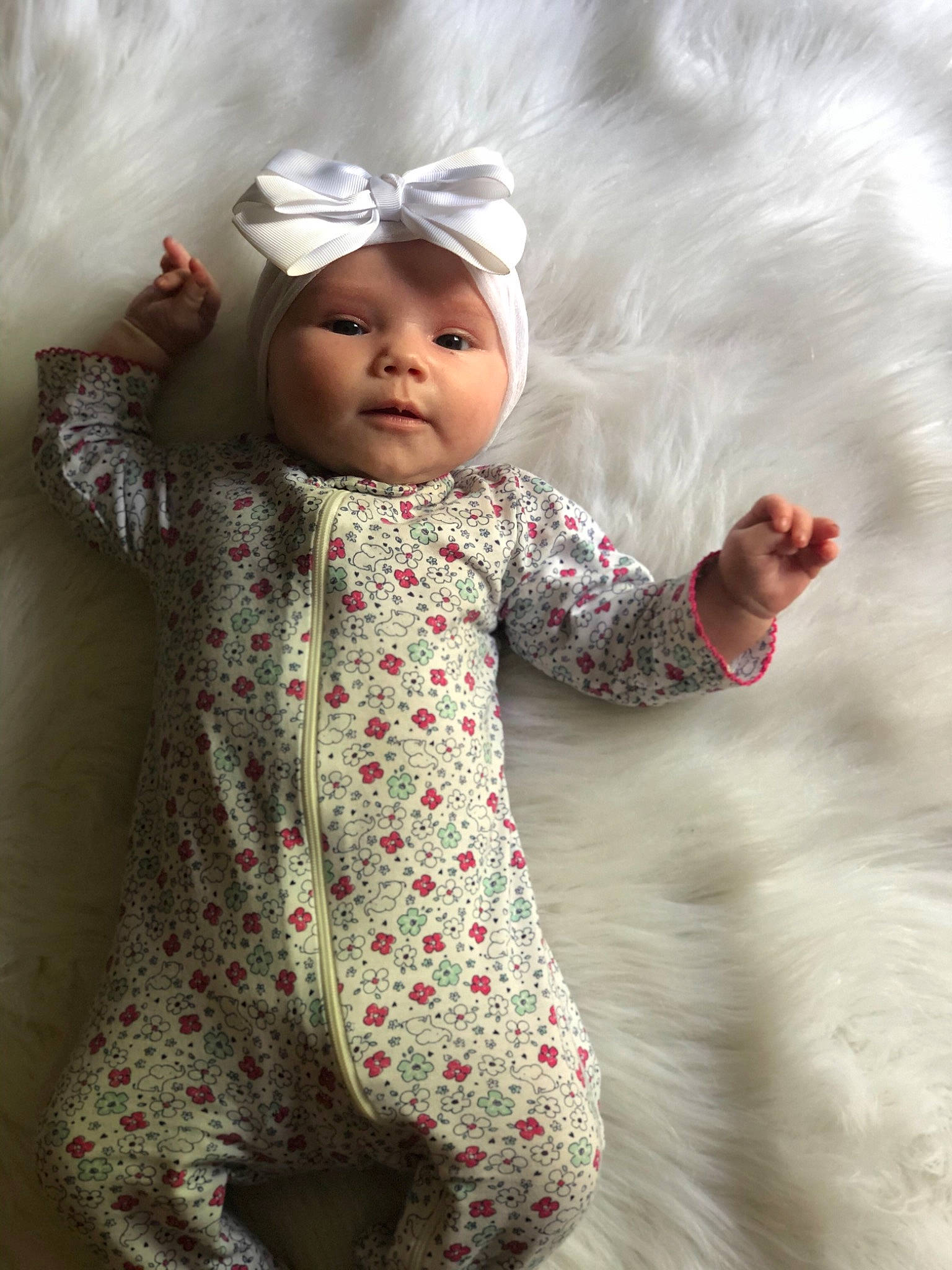 Jolie is registered to the contest to win money with this photo: baby, baby_toddler_clothing, child, headgear, headwear, knitting, outerwear, pattern, person, pink, skin, sleeve, smile, toddler, wool