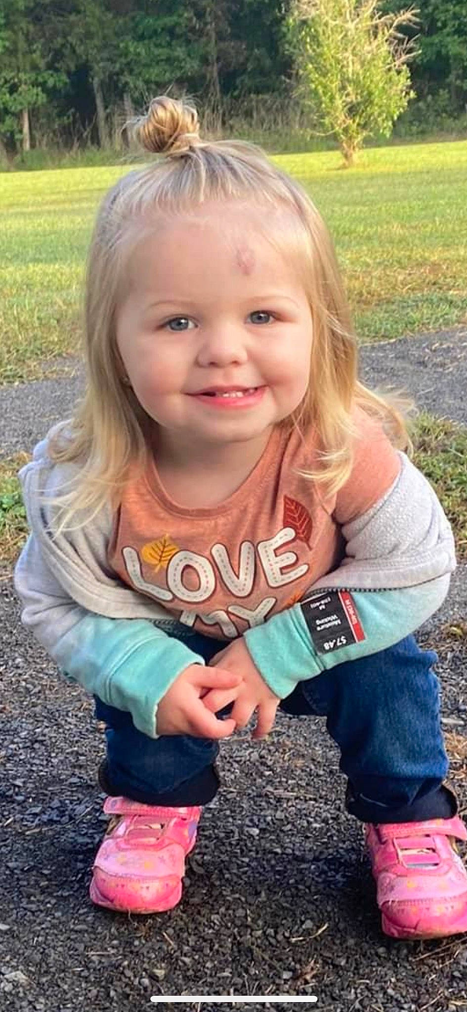 Ella is registered to the contest to win money with this photo: baby_toddler_clothing, cool, face, facial_expression, finger, fun, gesture, grass, hair, hairstyle, happy, head, joy, leaf, lip, people_in_nature, person, plant, skin, sleeve