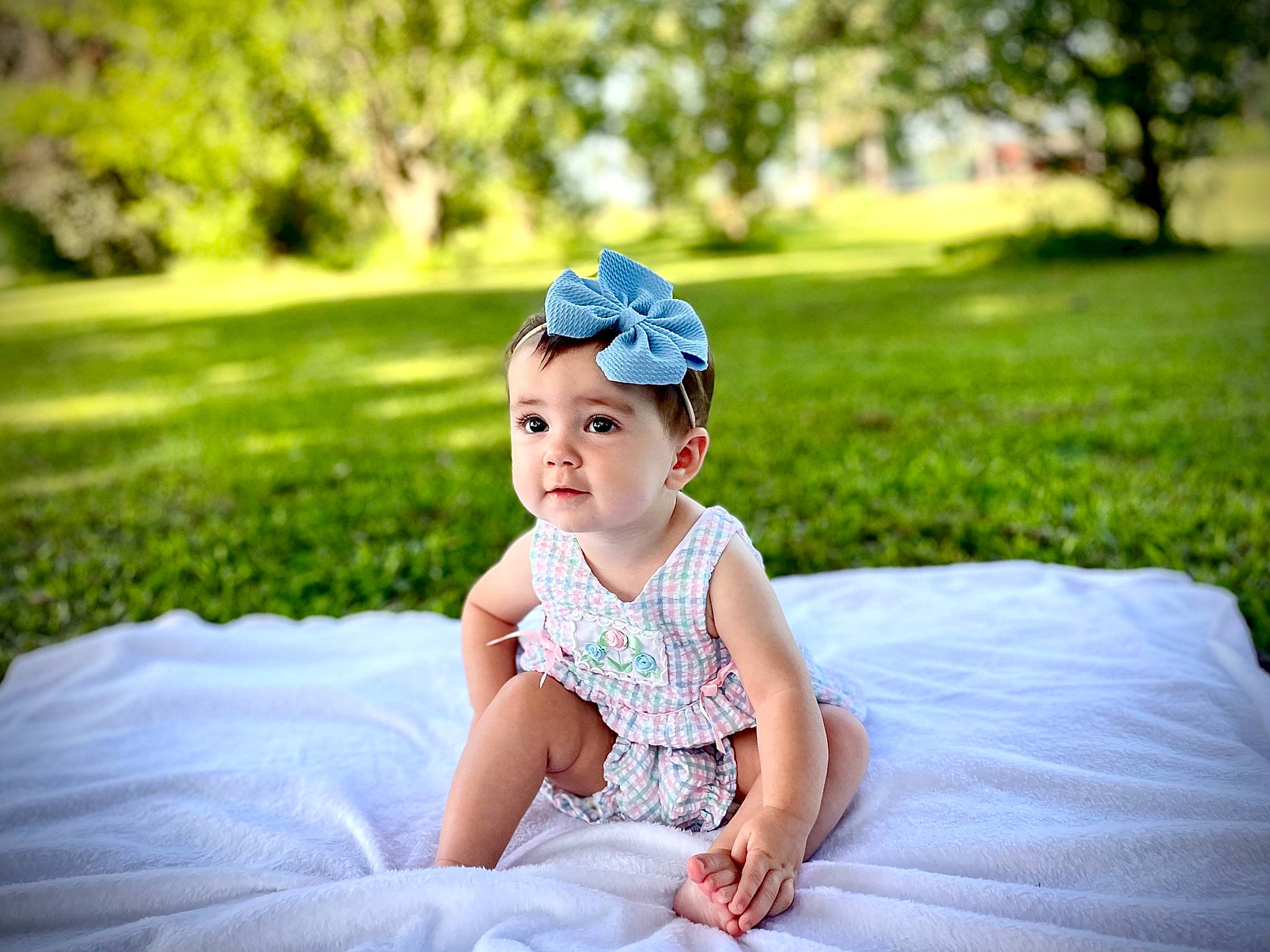 Adlee is registered to the contest to win money with this photo: baby, baby_toddler_clothing, dress, electric_blue, flash_photography, fun, grass, grassland, happy, headwear, leaf, leisure, light, meadow, people_in_nature, person, plant, recreation, summer, sunlight