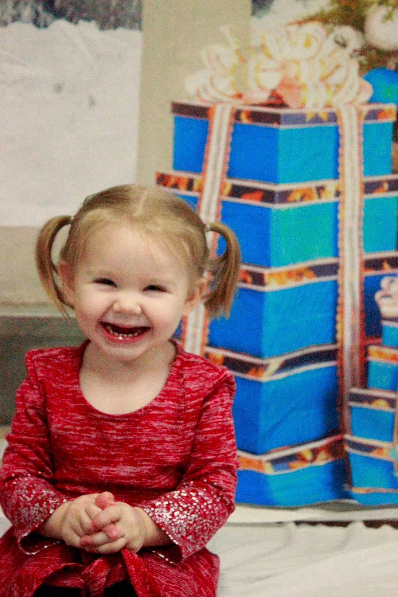 Vylette is registered to the contest to win money with this photo: blue, child, dress, facial_expression, fun, happy, joy, person, play, sitting, smile, textile, toddler