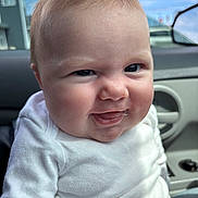 Lena is registered to the contest to win money with this photo: baby, child, face, smile, white_shirt, pink_pants, car_interior, window, car_door, cheeks, skin, expression, person, indoor, clothing, head, portrait, seat, hair, mischievous