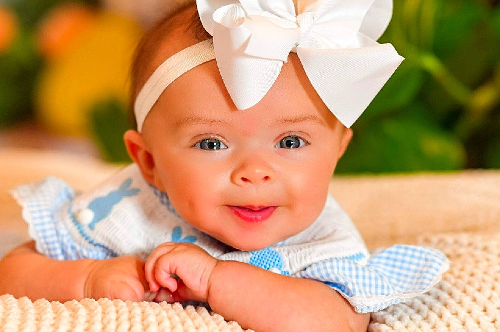 Jordyn is registered to the contest to win money with this photo: baby, baby_toddler_clothing, cap, child, costume_hat, event, eye, fashion_accessory, finger, fun, grass, happy, headband, headpiece, headwear, pattern, people_in_nature, person, portrait_photography, skin