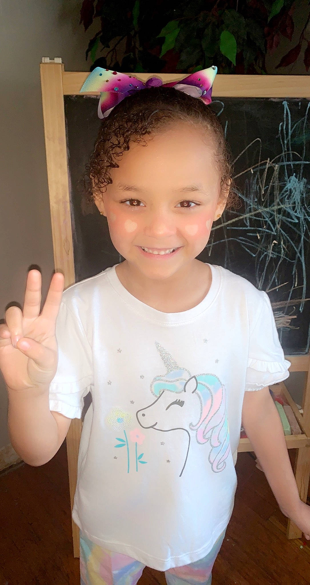 Athena is registered to the contest to win money with this photo: baby_toddler_clothing, cheek, cool, eye, eyebrow, eyelash, face, facial_expression, finger, forehead, gesture, hairstyle, happy, head, joy, neck, organ, person, skin, sleeve