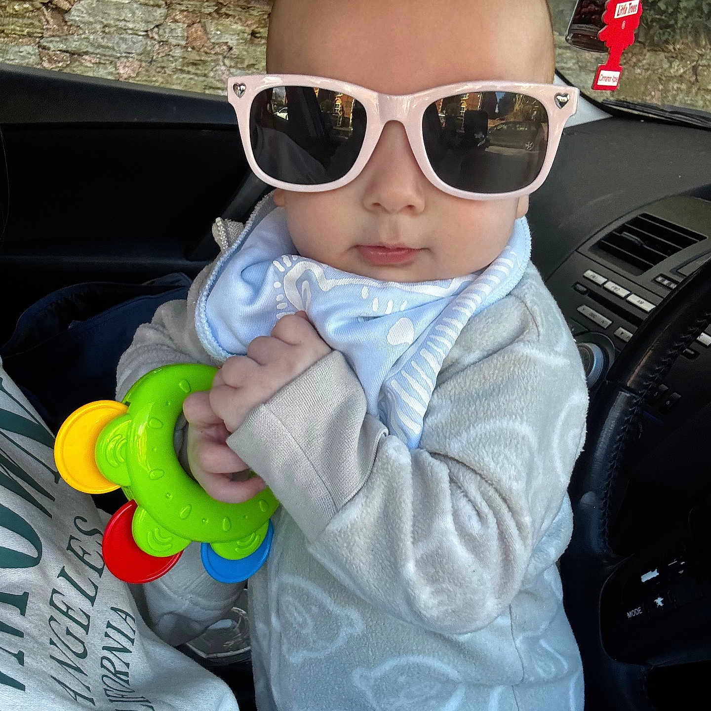 Noah joined the competition — help win amazing prizes! accessories, baby, car, clothing, coat, face, glasses, hat, head, jacket, machine, person, photography, portrait, sitting, sunglasses, toy, transportation, vehicle, wheel