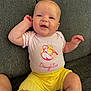 baby, babylaughing, bodypart, clothing, couch, cushion, face, furniture, happy, head, homedecor, laughing, newborn, pants, person, photography, portrait, shorts, sitting, t_shirt