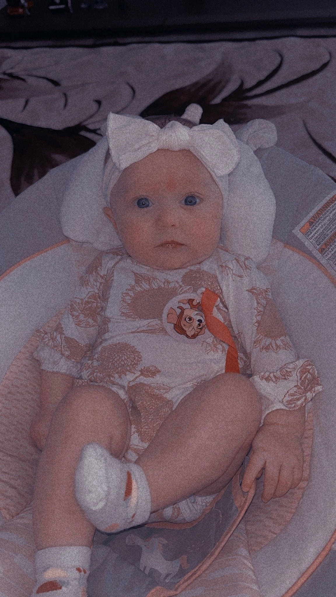 Brynlee joined the competition — help win amazing prizes! baby, baby_products, baby_toddler_clothing, cheek, child, comfort, dress, embellishment, eye, fashion_accessory, hair_accessory, headpiece, iris, lip, person, pink, sitting, skin, textile, toddler