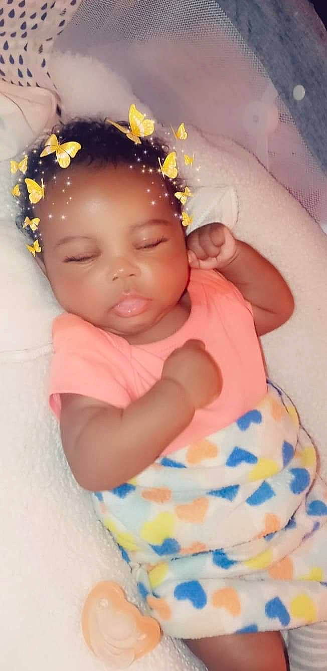 Brinae is registered to the contest to win money with this photo: arm, baby, baby_toddler_clothing, cheek, child, chin, eye, flower, fun, happy, headband, headgear, headpiece, iris, jewellery, person, pink, skin, sleeve, textile