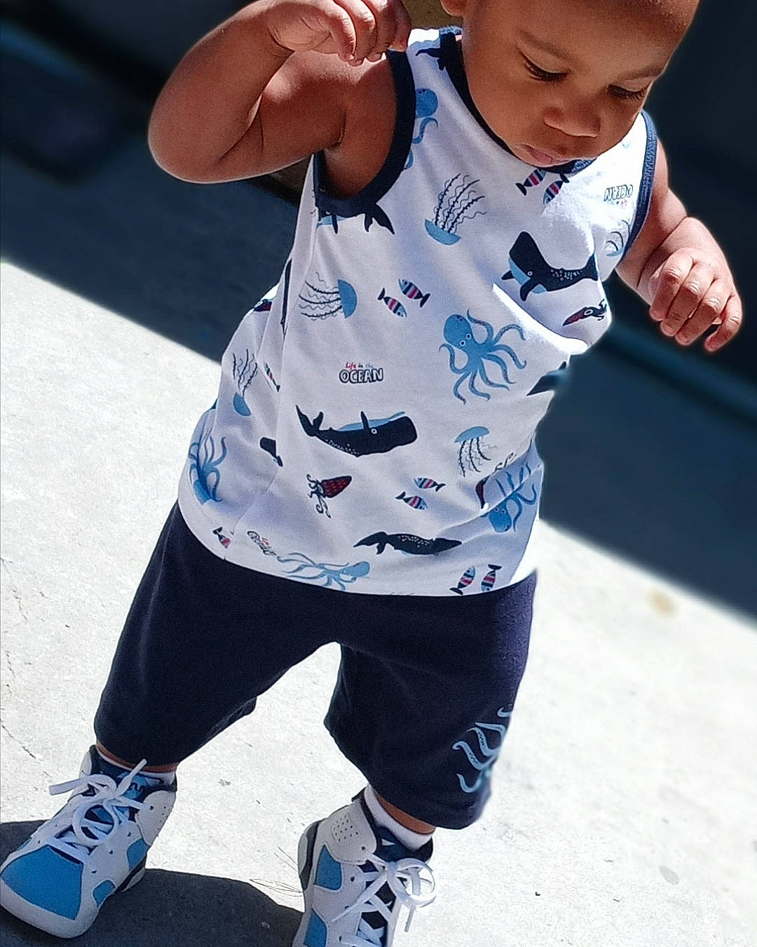 Nasrani joined the competition — help win amazing prizes! active_pants, baby_toddler_clothing, child, cool, electric_blue, entertainment, fun, gesture, hand, happy, person, recreation, shoe, sleeve, sneakers, sportswear, sweatpant, t_shirt, thigh, toddler