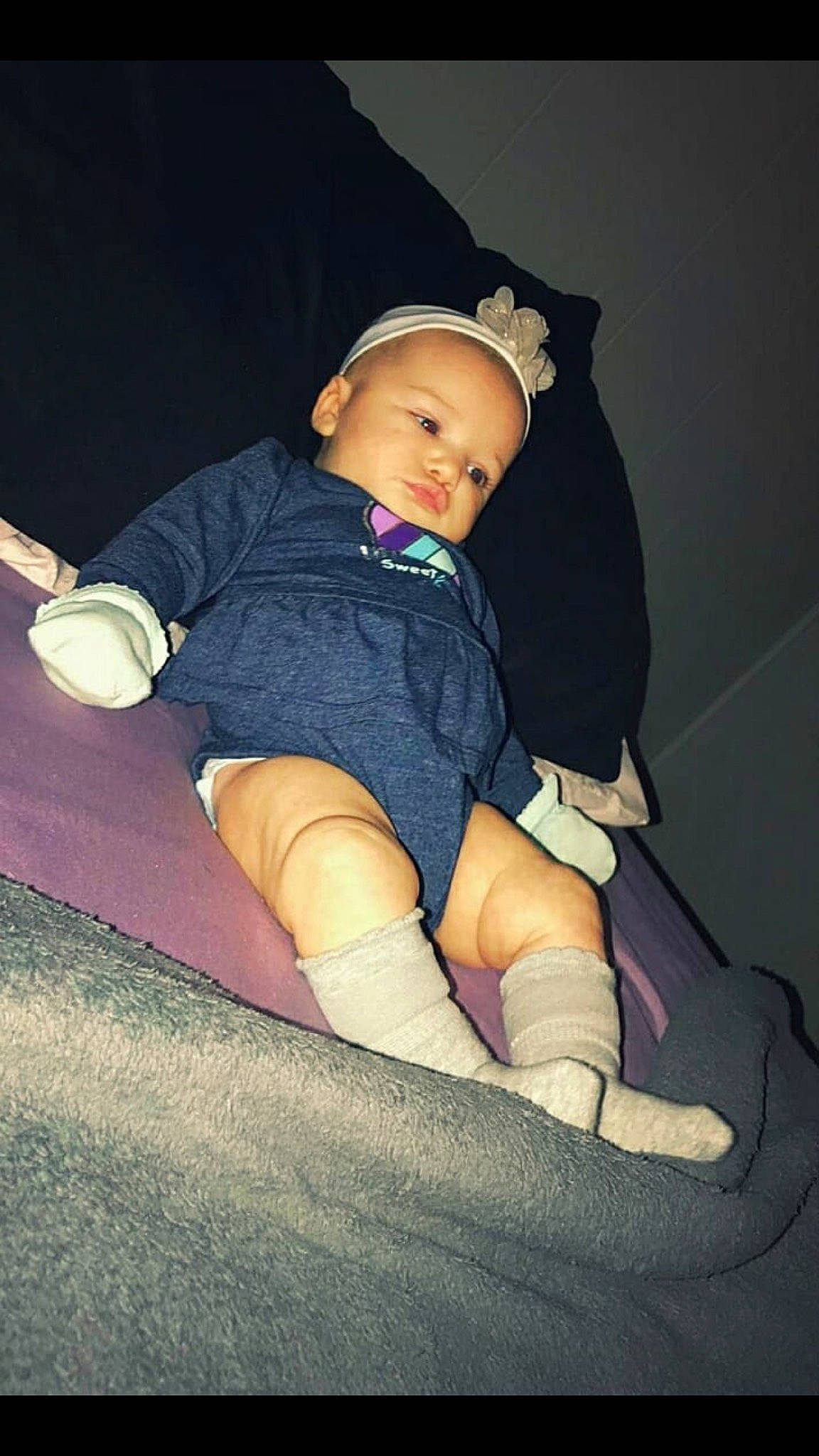 Arayah is registered to the contest to win money with this photo: arm, baby, cheek, child, finger, footwear, hand, human_body, human_leg, joint, knee, leg, person, pink, shoe, sitting, skin, thigh, thumb, tights