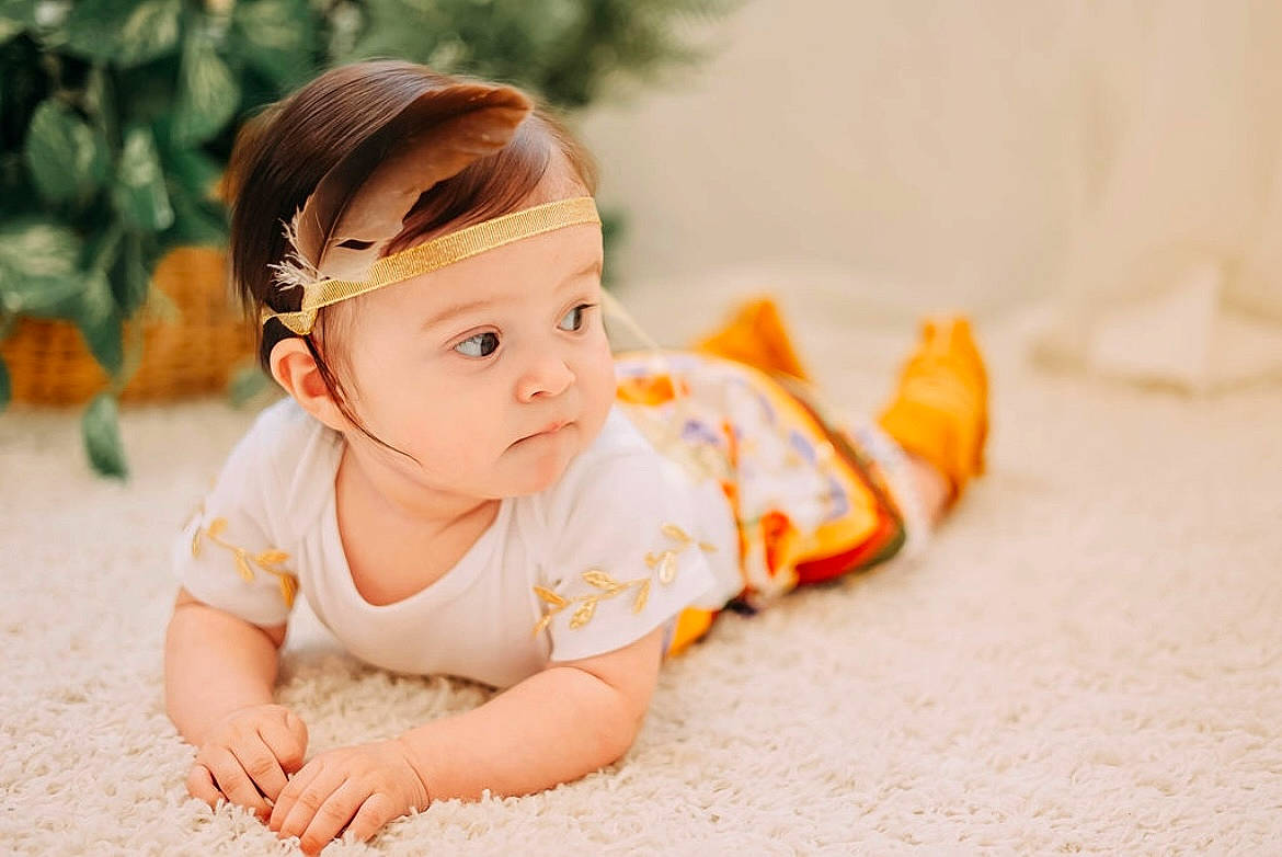 Raiya is registered to the contest to win money with this photo: baby, baby_toddler_clothing, child, fashion_accessory, flooring, fun, grass, hair_accessory, hair_tie, happy, headband, headpiece, people_in_nature, person, portrait_photography, sitting, skin, sleeve, smile, toddler