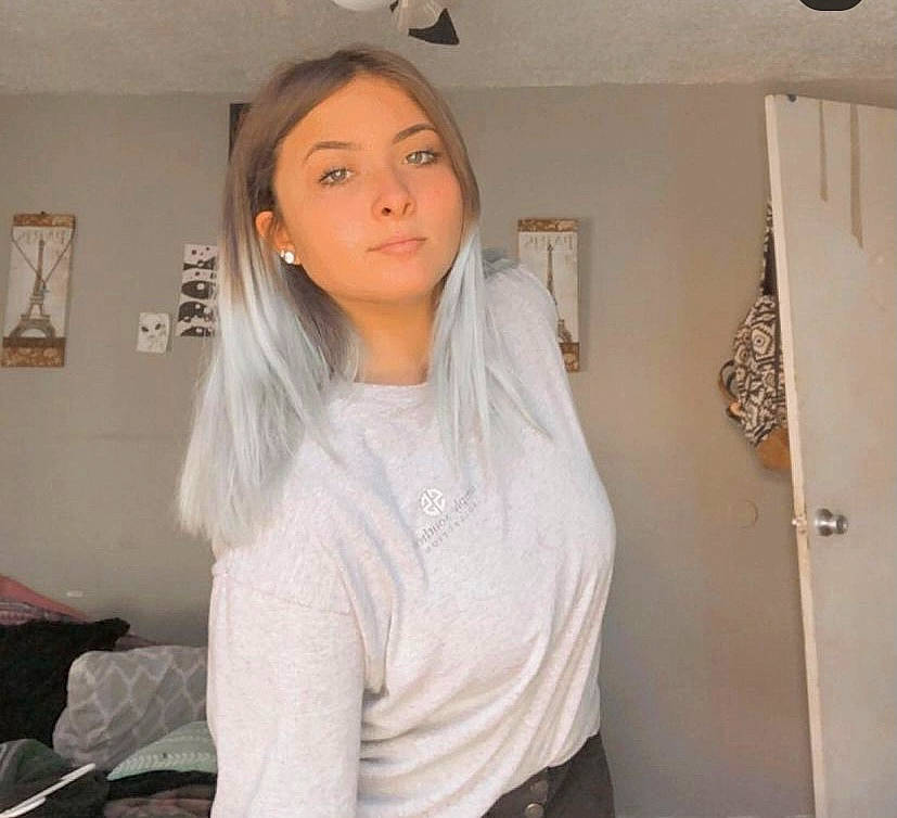 Kallie is registered to the contest to win money with this photo: blond, chest, comfort, elbow, eyebrow, eyelash, gesture, hair, hairstyle, jaw, joint, layered_hair, long_hair, long_sleeved_t_shirt, neck, person, picture_frame, shoulder, sleeve, trunk