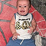 Andrew is registered to the contest to win money with this photo: baby, boy, smiling, blanket, clothing, blue_shorts, sleeveless_shirt, happy, infant, cute, child, person, indoor, carpet, playtime, portrait, young, skin, face, lying_down