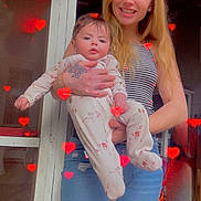 Whitley Jean joined the competition — help win amazing prizes! baby, infant, woman, adult, holding, hearts_overlay, onesie, ripped_jeans, striped_top, tattoo, bracelet, smile, doorway, porch, hands, long_hair, casual_clothing, portrait, filter_effect, family