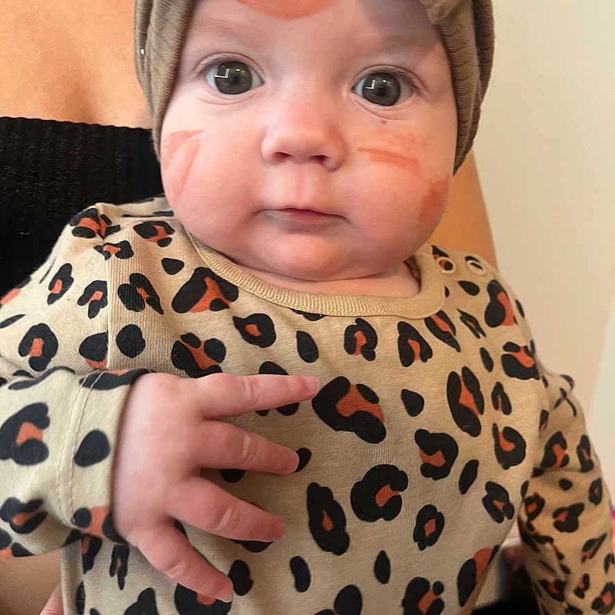 Paislie is registered to the contest to win money with this photo: baby, beanie, bodypart, bonnet, cap, clothing, face, finger, hand, happy, hat, head, hood, knitwear, newborn, person, photography, portrait, smile, sweater