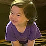 Juliette is registered to the contest to win money with this photo: carpet, child, cute, face, floor, furniture, hair, hands, happy, home, indoor, leggings, person, playful, purple_shirt, rug, smiling, socks, standing, toddler