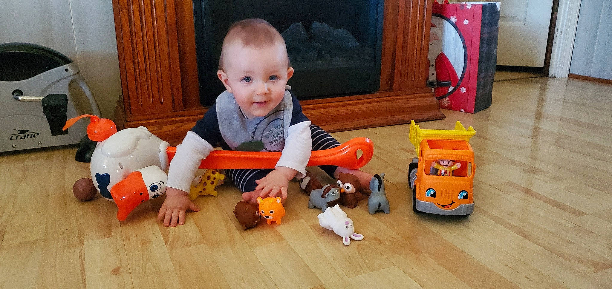 Krimson joined the competition — help win amazing prizes! baby, baby_playing_with_toys, baby_toddler_clothing, cheek, child, facial_expression, floor, flooring, fun, happy, hardwood, head, orange, person, play, room, sitting, smile, toddler, toy