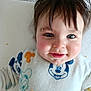Maël participe au concours pour gagner de l'argent avec cette photo : baby, child, face, smiling, messy, hair, blue_eyes, mickey_mouse, clothing, crumbs, cute, indoors, portrait, sitting, infant, happy, person, soft, fabric, closeup