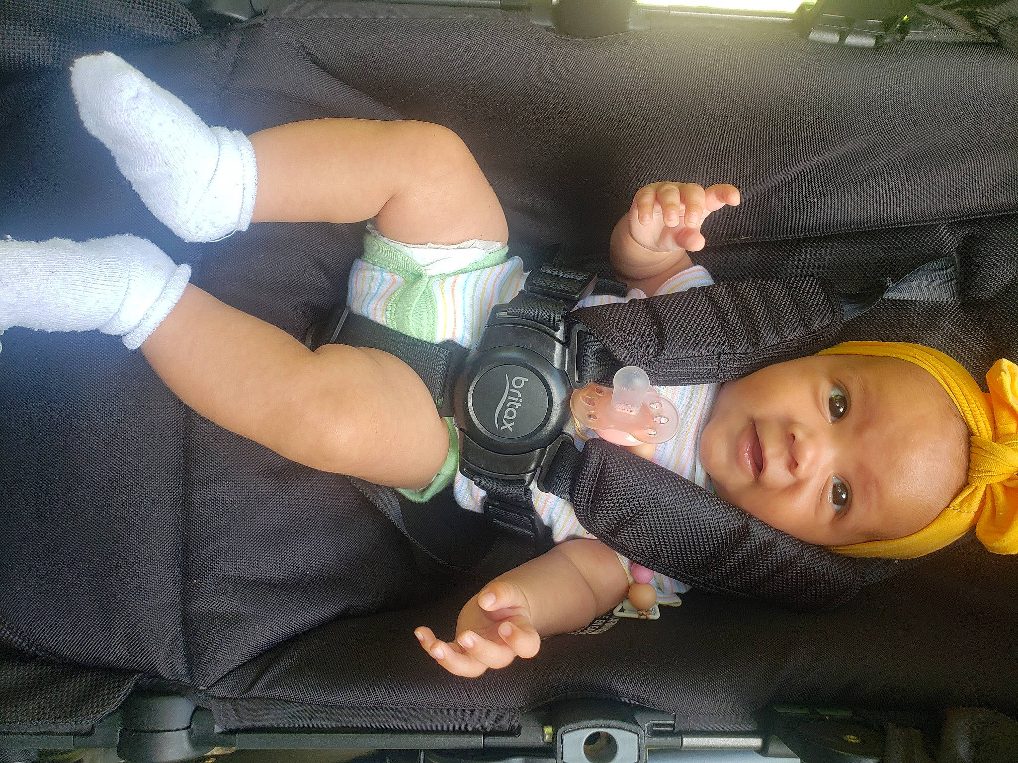 Catalina is registered to the contest to win money with this photo: auto_part, baby, baby_carriage, baby_products, baby_toddler_clothing, car_seat, comfort, elbow, finger, gesture, human_leg, knee, nail, person, product, snapshot, thigh, thumb, toddler, vehicle_door