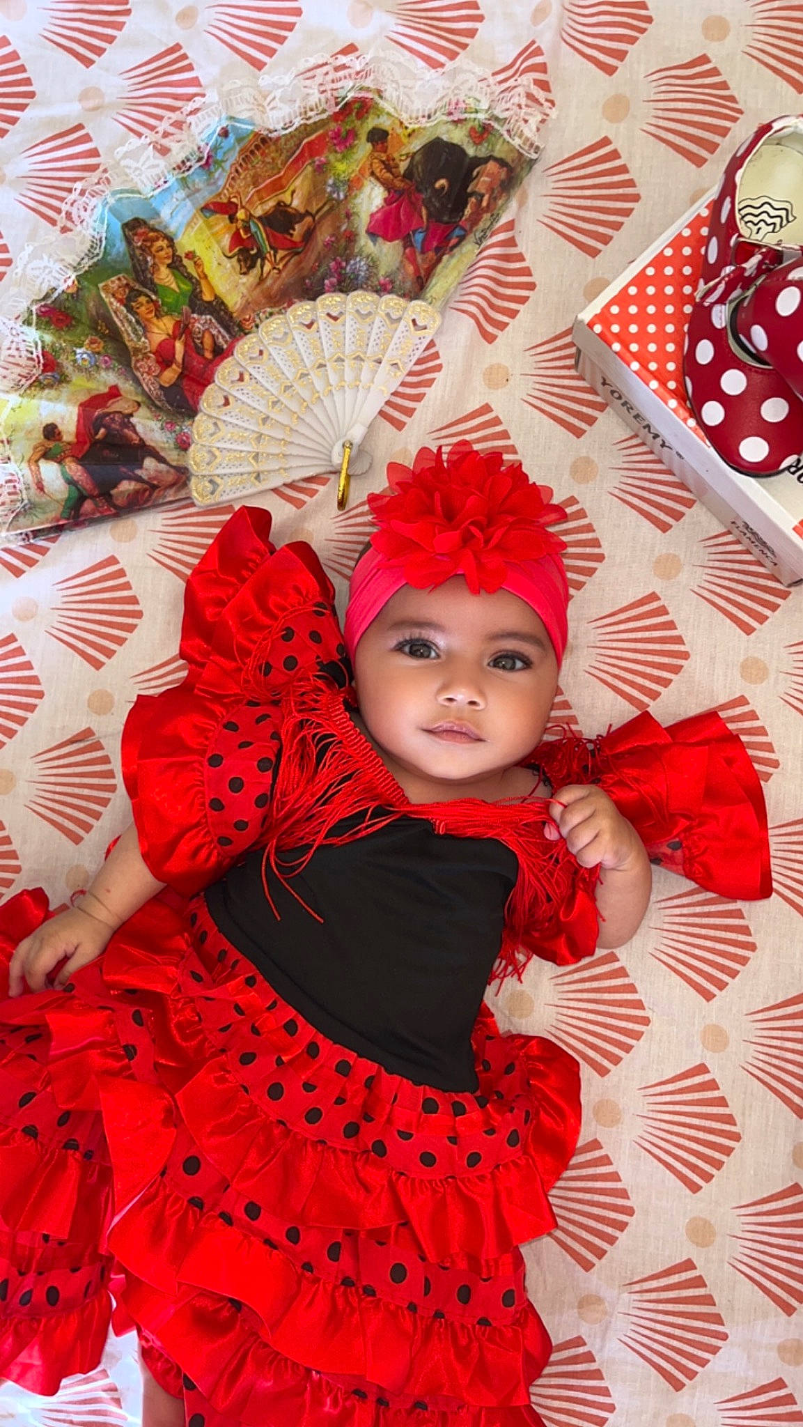 Tinaya participe au concours pour gagner de l'argent avec cette photo : art, baby_toddler_clothing, dress, entertainment, event, eyelash, face, fashion_design, hair_accessory, headgear, headpiece, headwear, magenta, orange, pattern, performing_arts, person, petal, pink, plant