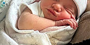 Phoebe is registered to the contest to win money with this photo: baby, blanket, child, closeup, comfort, cute, face, hat, human, indoor, infant, newborn, newborn_clothing, peaceful, person, resting, skin, sleeping, soft, wrapped