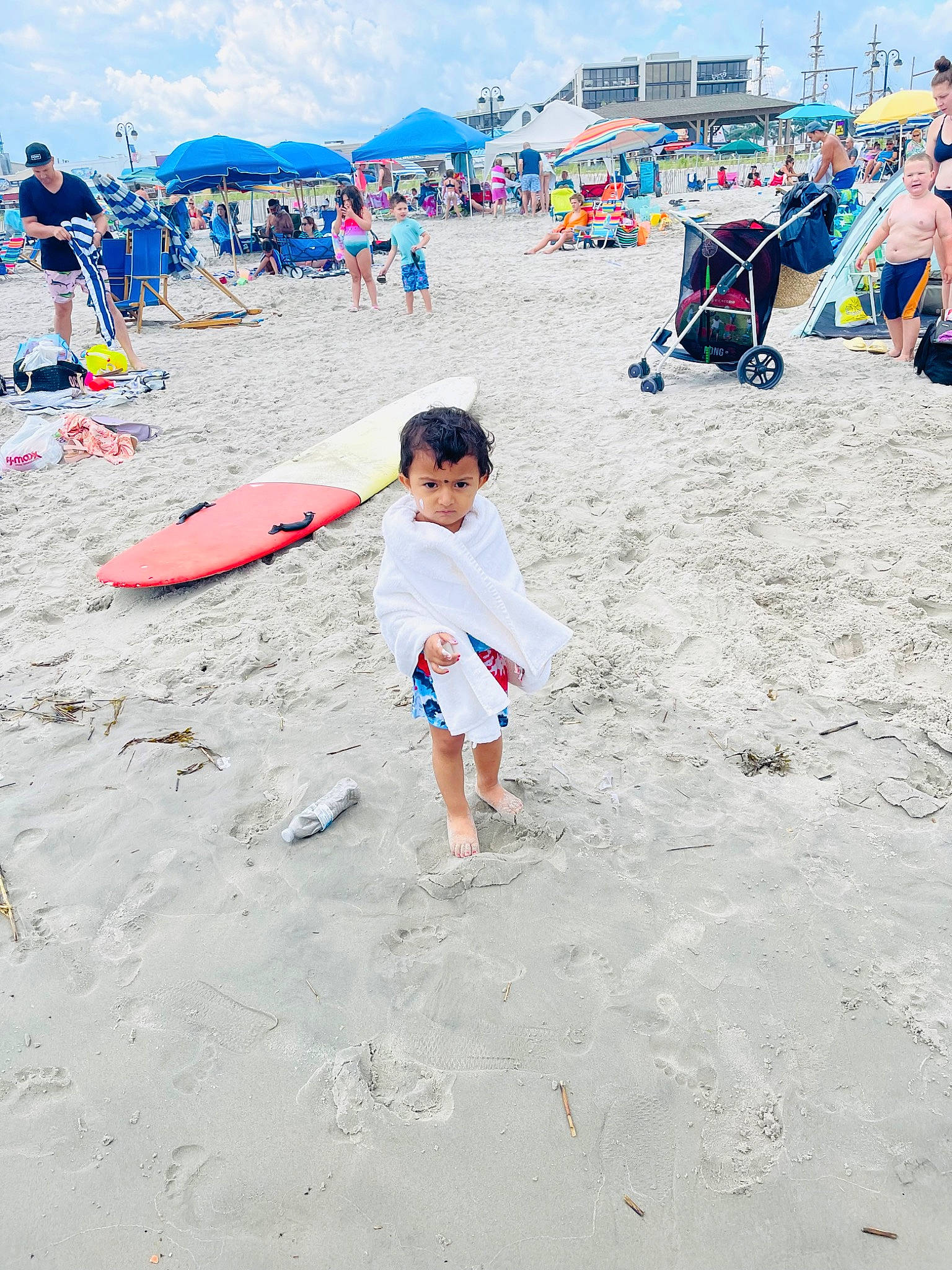 Sophia joined the competition — help win amazing prizes! beach, board_short, body_of_water, cloud, coast, fun, headwear, leisure, people_on_beach, person, recreation, sand, shade, shore, shorts, sky, sports_equipment, surfboard, travel, umbrella