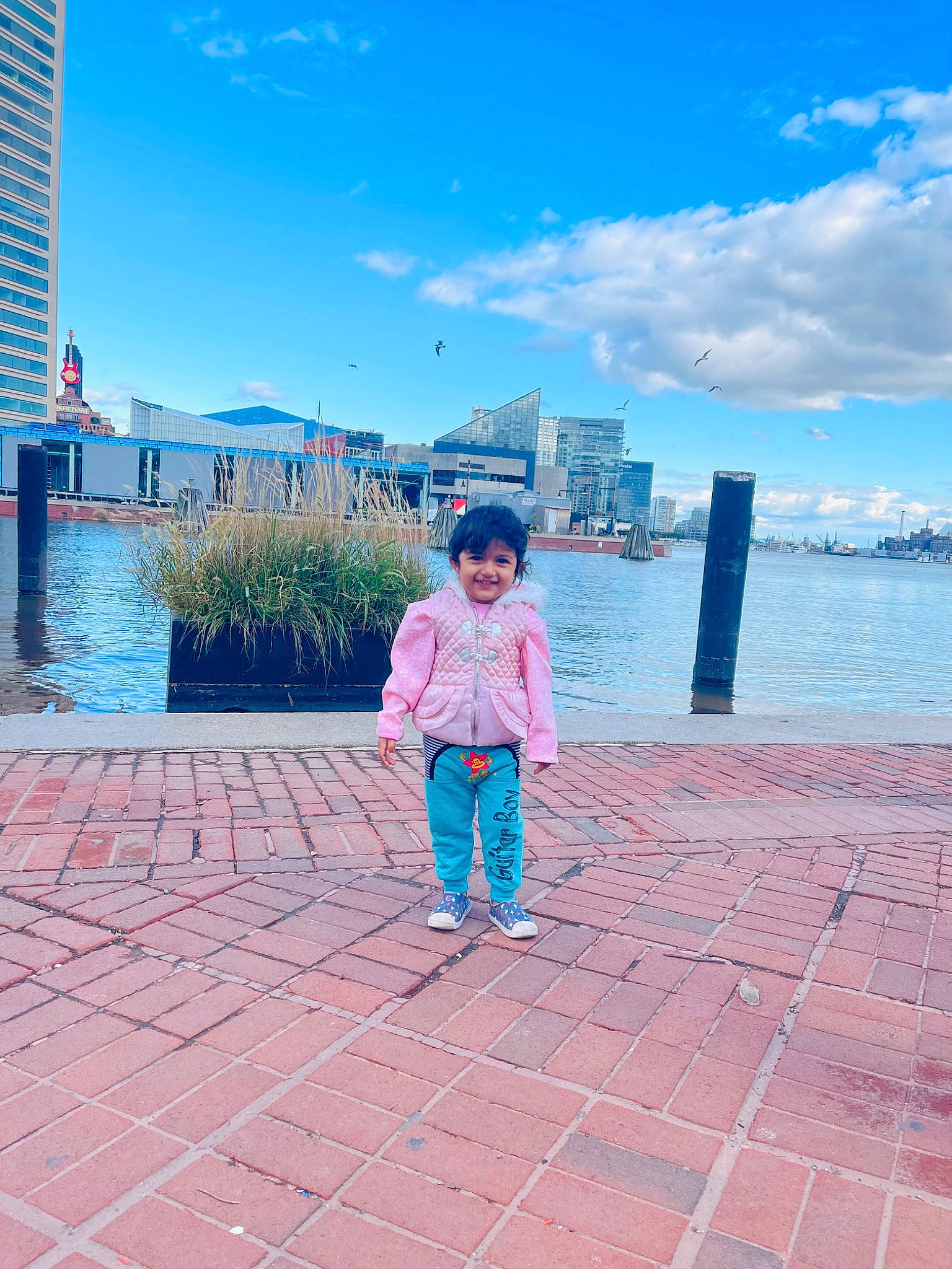 Sophia joined the competition — help win amazing prizes! azure, blue, building, city, cloud, electric_blue, flooring, fun, horizon, joy, lake, leisure, magenta, person, pink, plant, road_surface, sky, summer, toddler