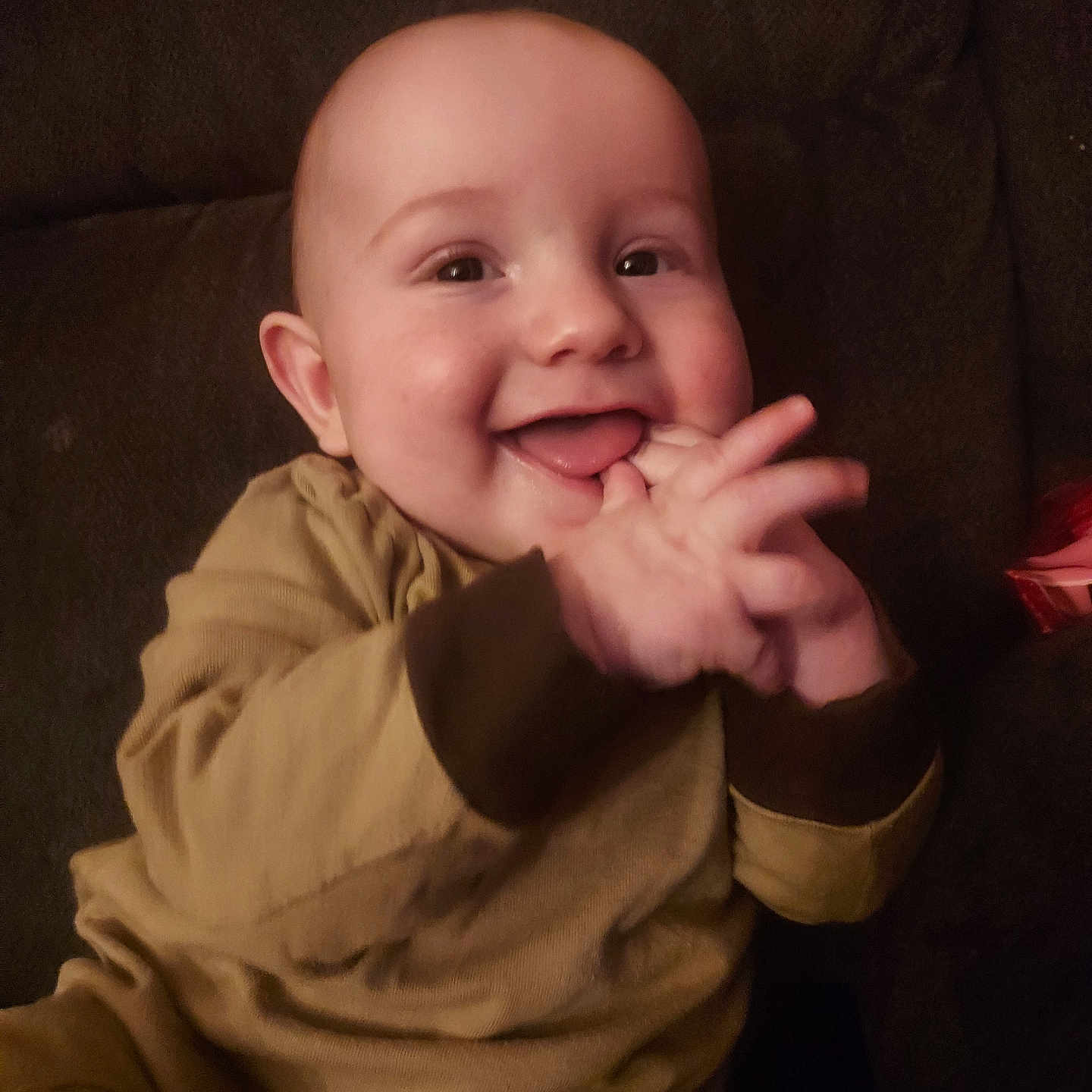 Duwane is registered to the contest to win money with this photo: baby, babylaughing, bodypart, clothing, coat, couch, face, finger, furniture, hand, happy, head, jacket, laughing, mouth, person, photography, portrait, smile, teeth