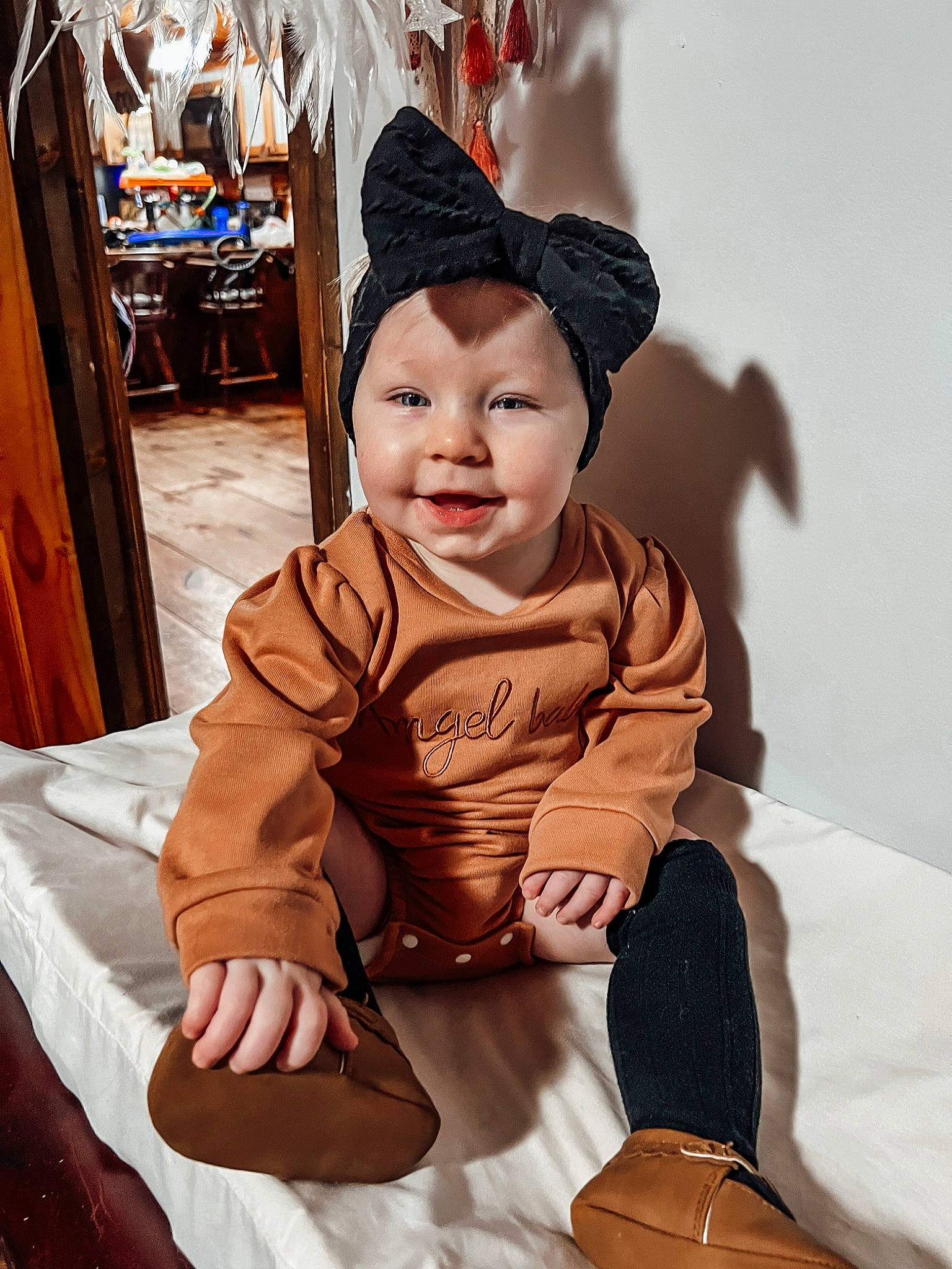 Lucy joined the competition — help win amazing prizes! baby, baby_toddler_clothing, bag, cap, chair, child, comfort, costume, event, flooring, fun, happy, hat, headwear, lap, outerwear, person, sitting, skin, sleeve