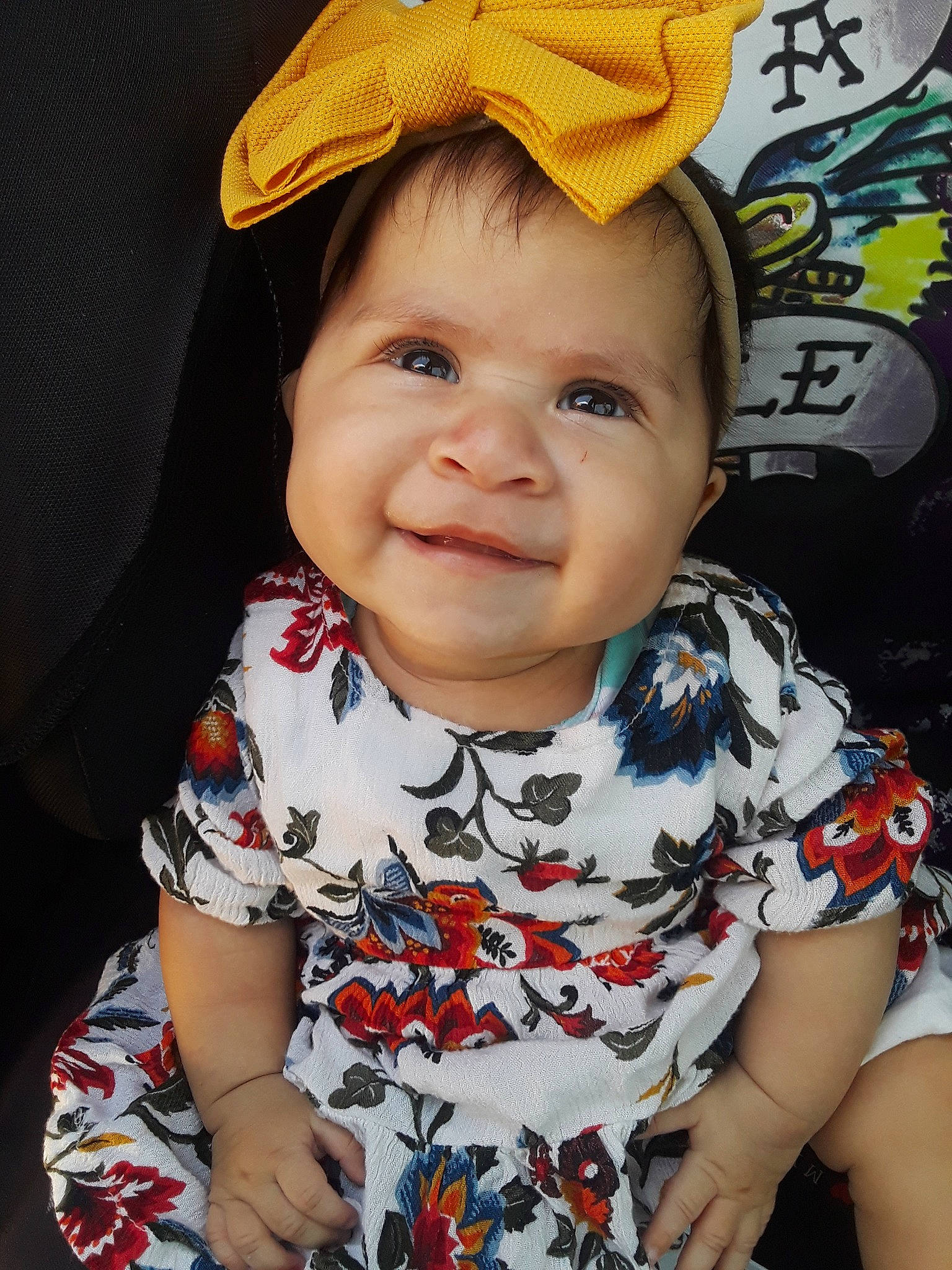 Samara joined the competition — help win amazing prizes! baby, baby_toddler_clothing, cap, cheek, child, dress, face, fashion_accessory, hat, head, headgear, lip, pattern, person, skin, sleeve, smile, sun_hat, toddler