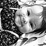 Mila a rejoint le concours — aidez-le/la à gagner de superbes lots ! apparel, baby, black_and_white, blanket, child, closeup, cute, expression, face, floral_pattern, happy, head, indoors, infant, lying_down, person, portrait, smile, soft_light, young
