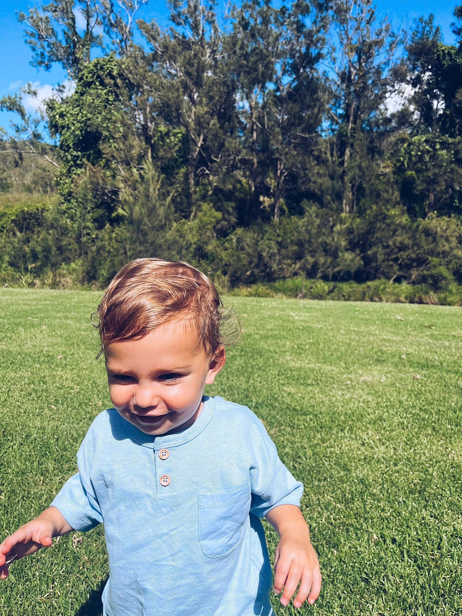 Gray is registered to the contest to win money with this photo: baby_toddler_clothing, cool, eye, grass, grass_family, grassland, hair, happy, joy, landscape, leaf, leisure, meadow, people_in_nature, person, plant, recreation, sky, smile, sunlight