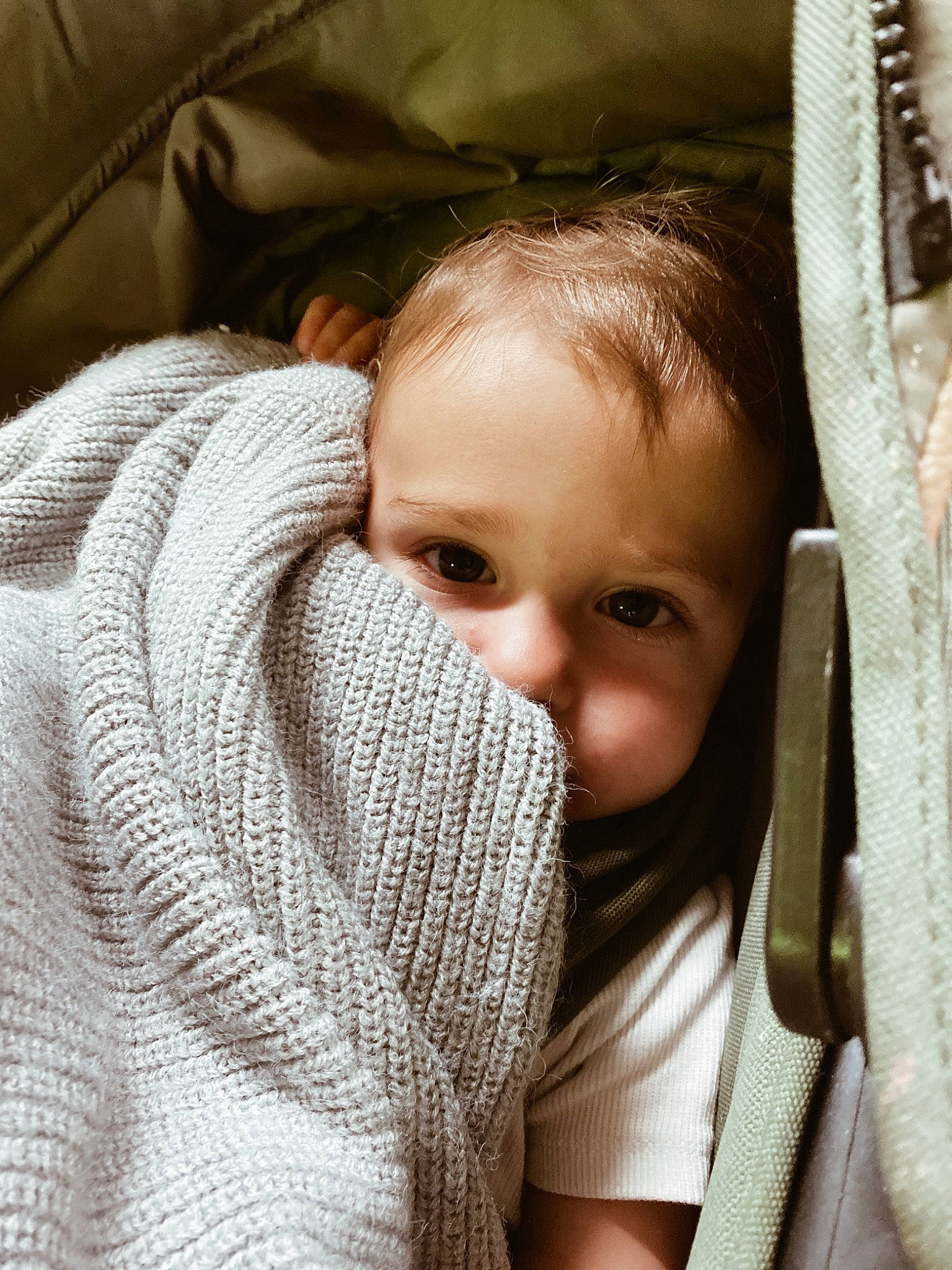 Gray is registered to the contest to win money with this photo: baby, cheek, child, chin, close_up, comfort, eye, eyebrow, eyelash, face, hair, head, iris, linens, lip, mouth, nose, person, sitting, skin