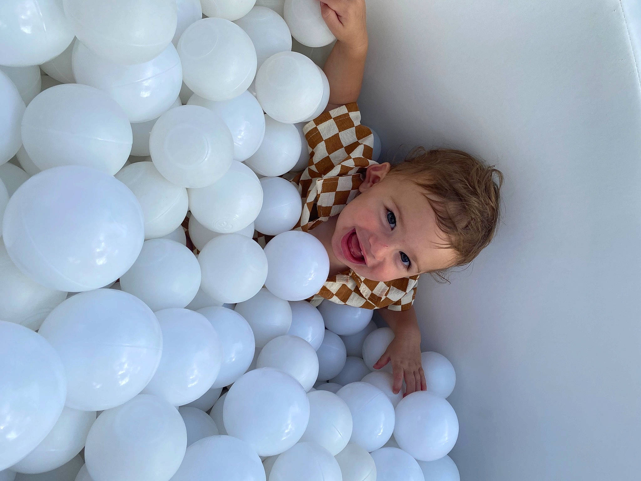 Gray is registered to the contest to win money with this photo: ball, balloon, child, circle, electric_blue, event, fun, gesture, happy, joy, party_supply, pattern, person, smile, toddler, toy