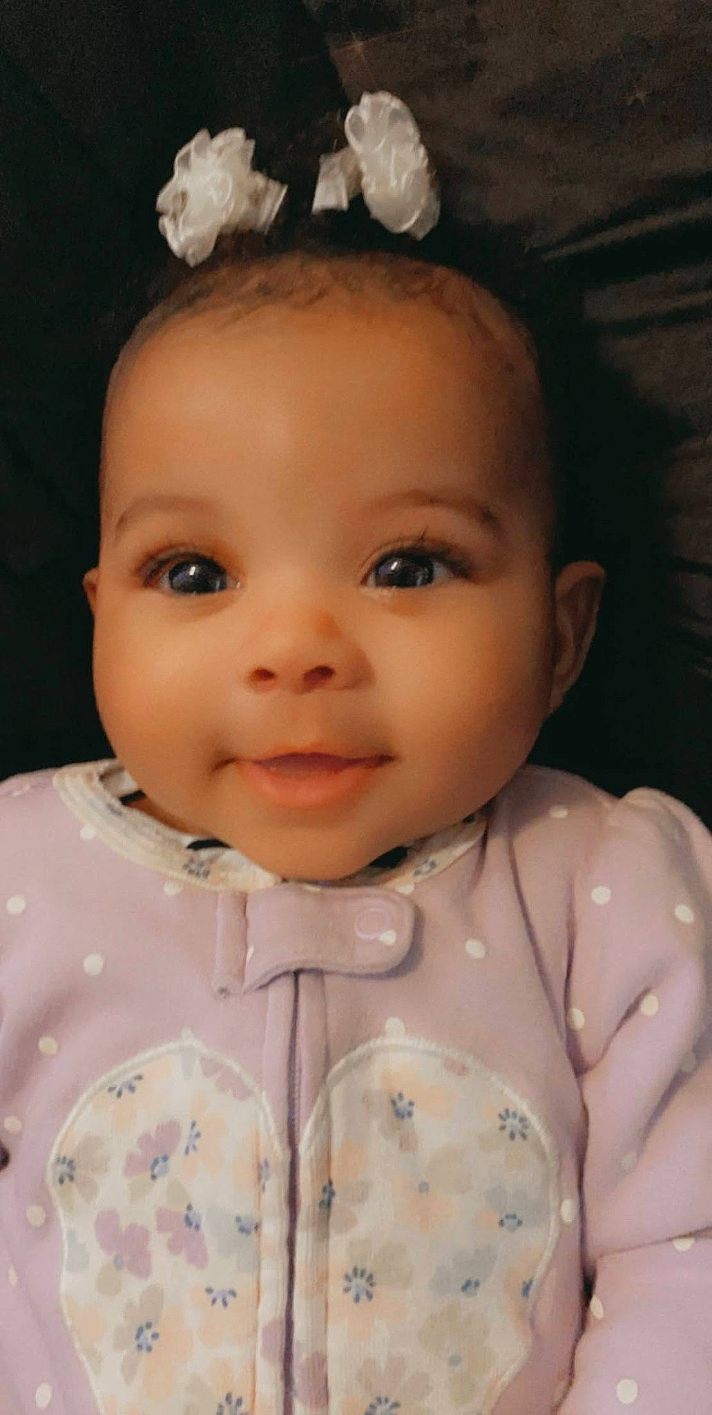 Londyn is registered to the contest to win money with this photo: baby_toddler_clothing, cheek, chin, collar, eye, eyebrow, eyelash, flash_photography, forehead, head, human_body, iris, lip, nose, organ, person, pink, skin, sleeve, smile