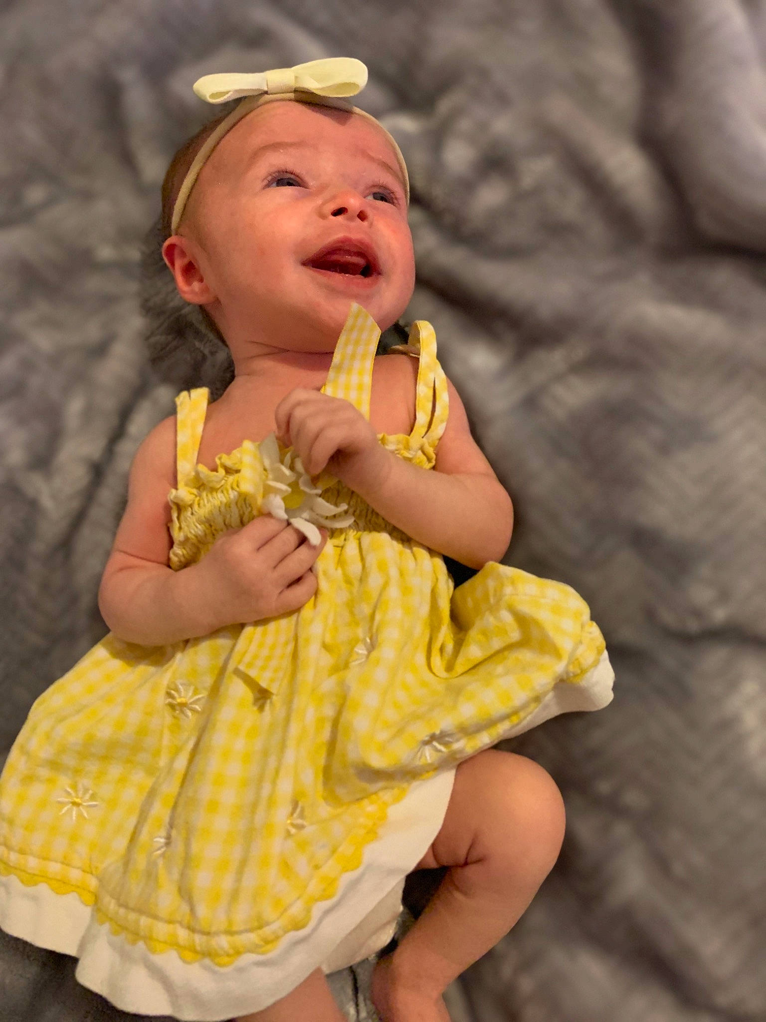 Quinn is registered to the contest to win money with this photo: baby, child, facial_expression, finger, fun, hand, happy, mouth, person, smile, toddler, vacation, yellow