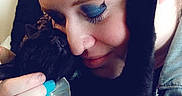 Annabelle is registered to the contest to win money with this photo: affection, black_cat, blue_eye_shadow, braided_hair, cat, close_up, face, gentle, hand, holding, indoor, intimate, love, nail_polish, pet, portrait, ring, skin, tattoo, woman