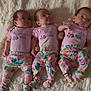 baby, newborn, infant, three, triplets, pink_clothing, floral_pants, lying_down, blanket, soft_texture, cute, infant_fashion, sleepwear, child, indoors, portrait, baby_girls, together, family, adorable