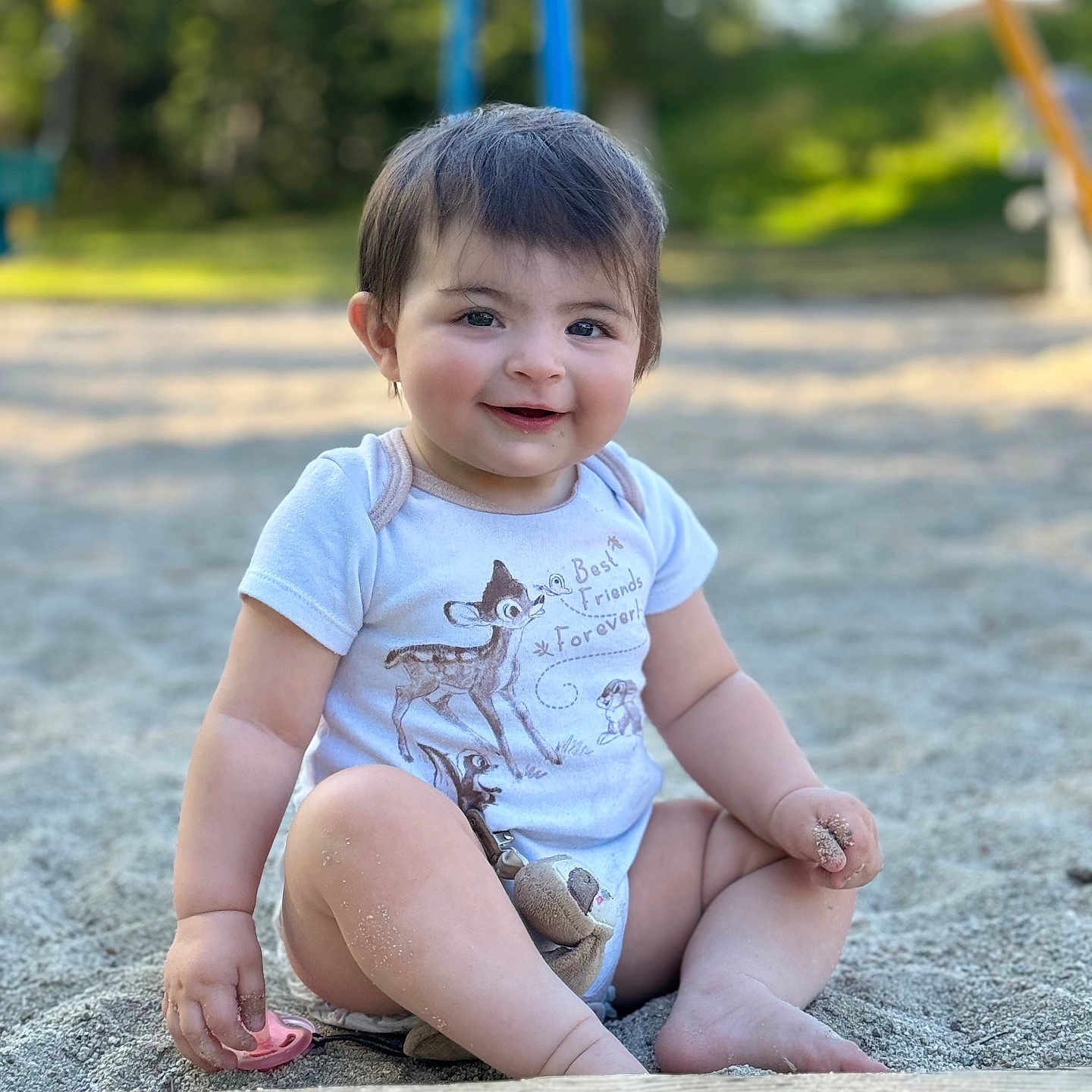 Natalie joined the competition — help win amazing prizes! baby, clothing, face, grass, happy, head, nature, outdoorplayarea, outdoors, pants, park, person, photography, plant, playarea, portrait, shorts, sitting, t_shirt, tree